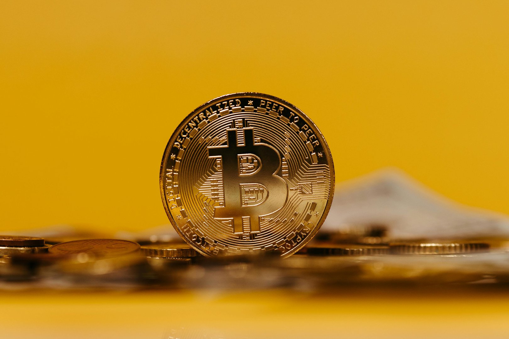 Bitcoin coin illustration on a yellow background